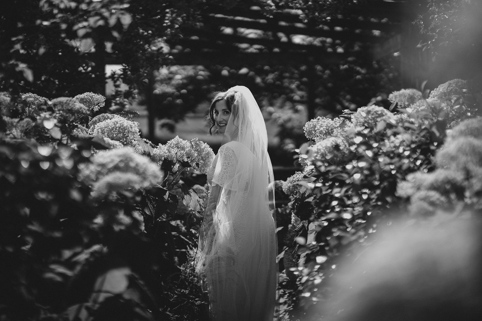 Bride in the sunken garden at Dewsall Court