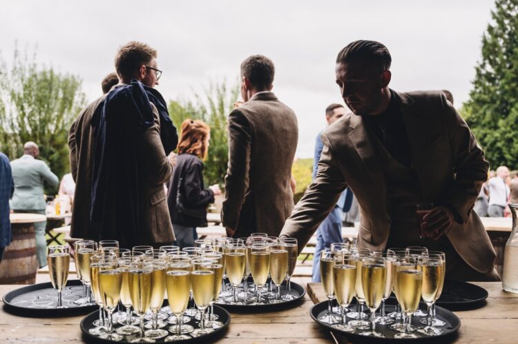 reception drinks and guests having fun at Lyde Court