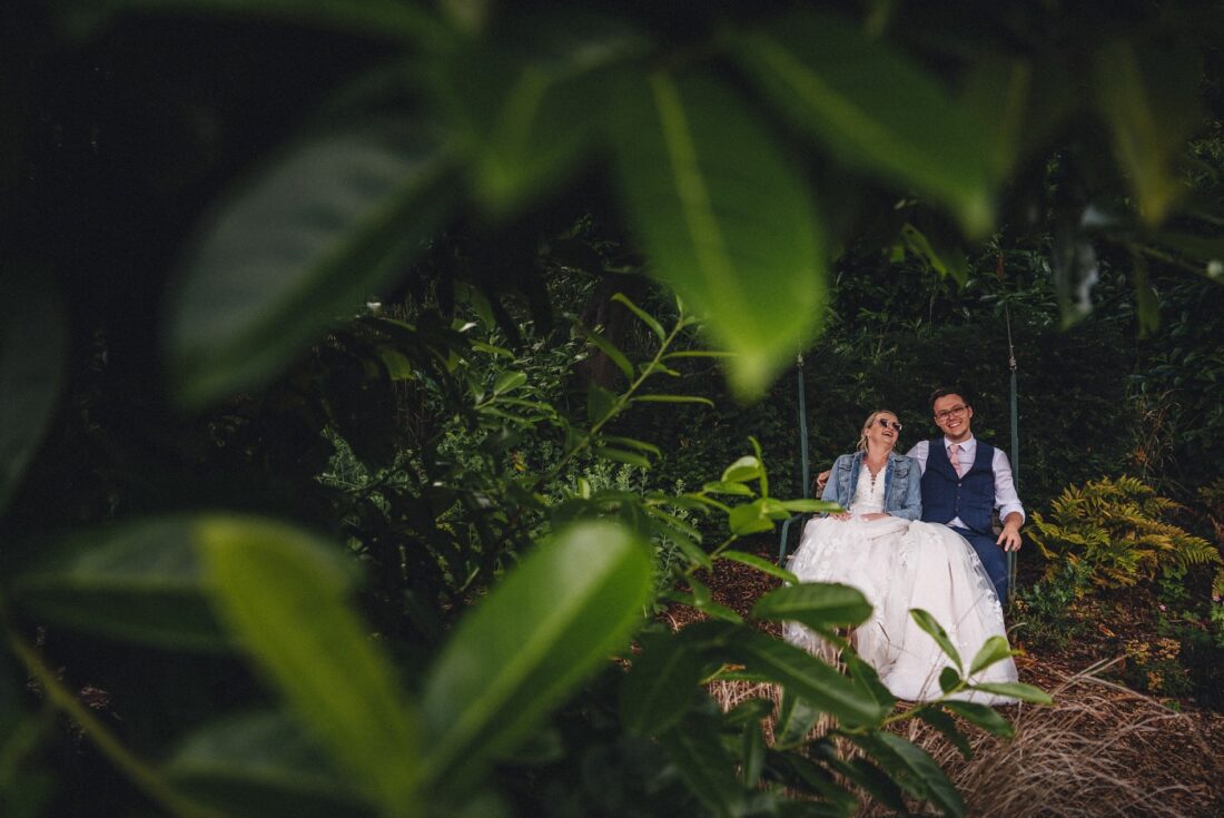 bride and groom swinging on the swing at Homme House