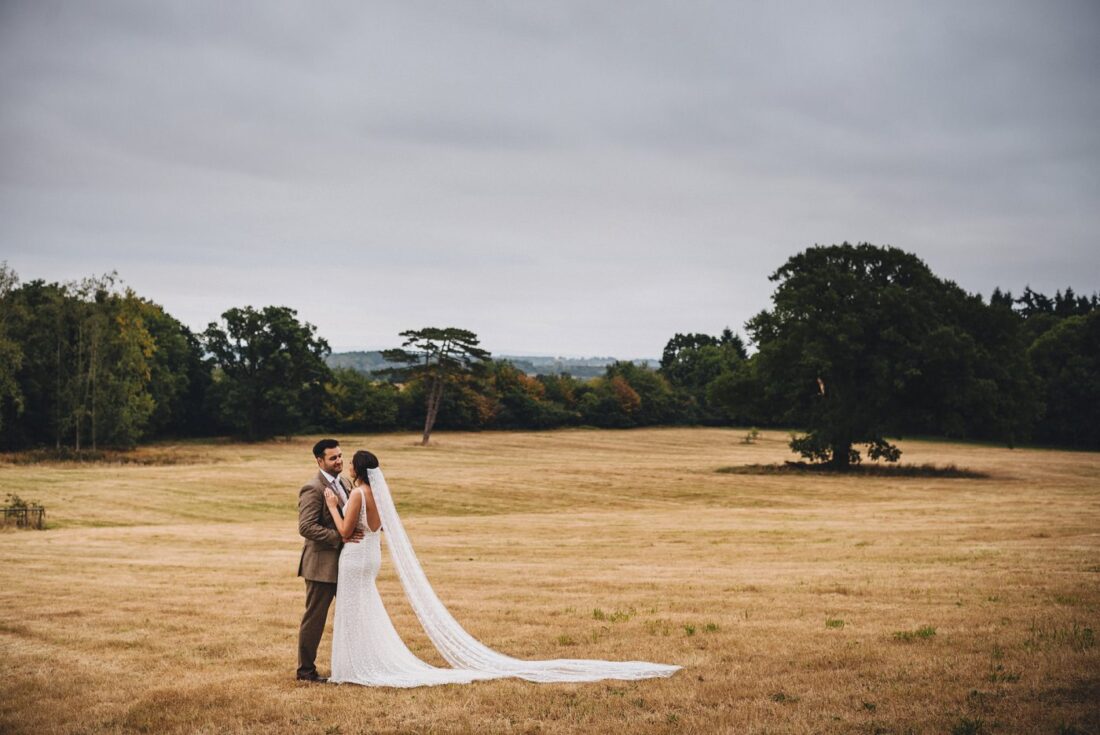 bride and groom together in the parkland at Homme House