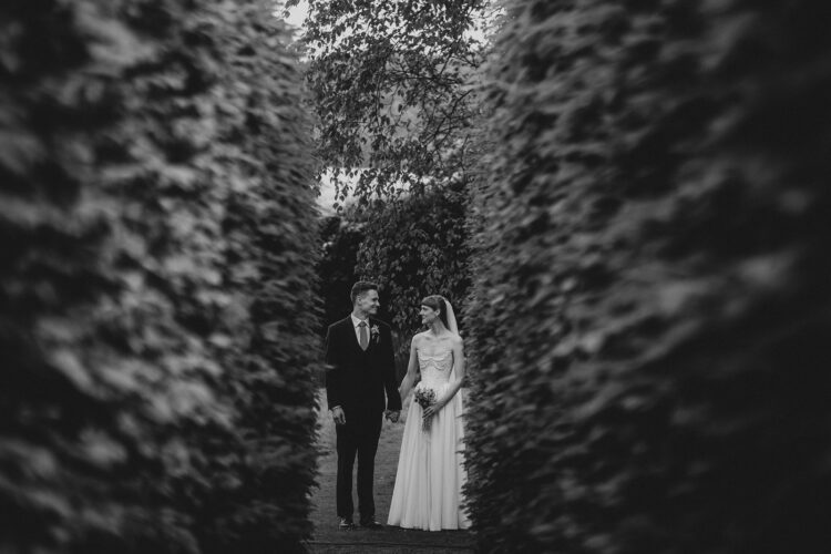 bride and groom walking in the Brobury House gardens