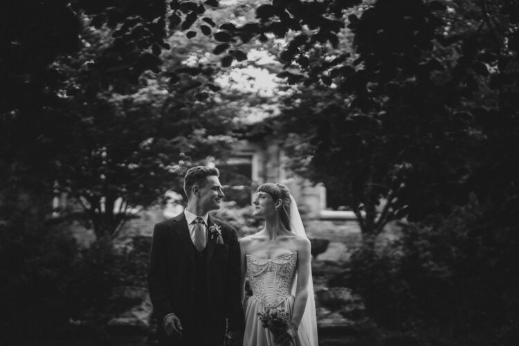 bride and groom walking in the Brobury House gardens