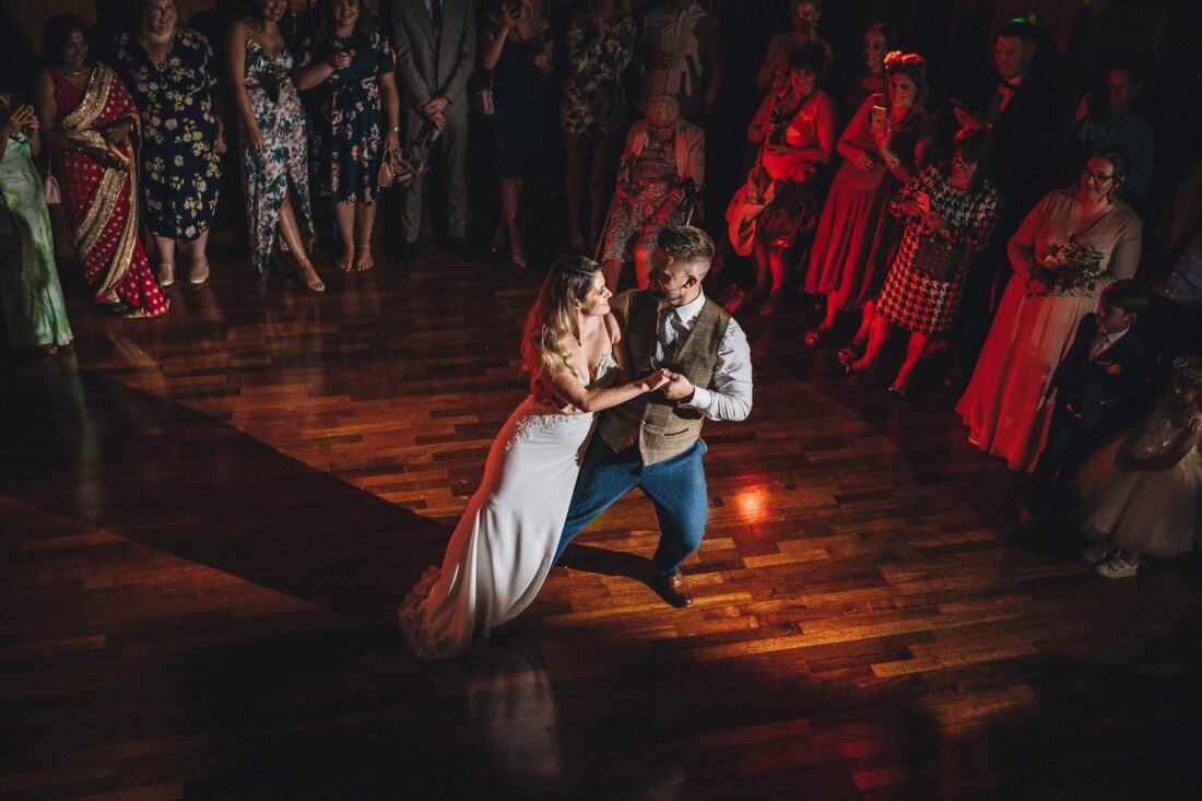 bride and groom doing their first dance and guests watching at Deer Park