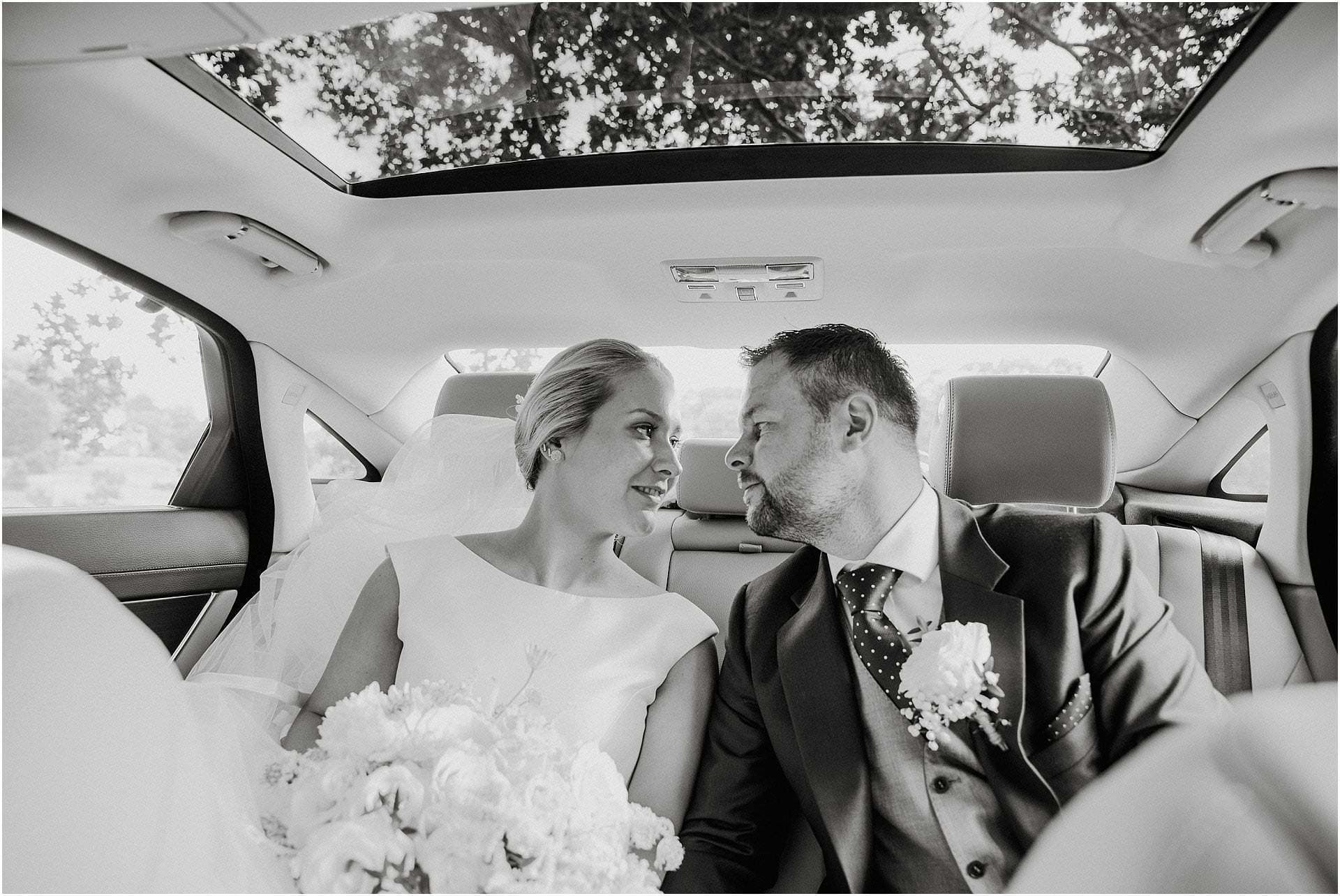 bride and groom in car