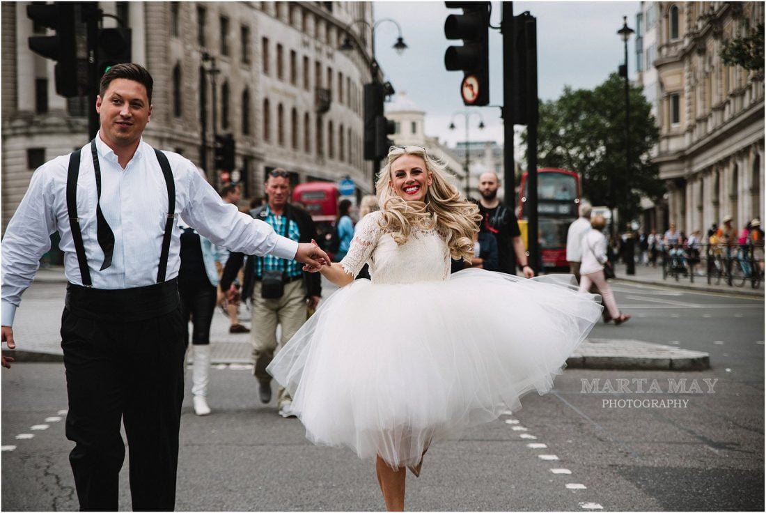 bride and groom running through the streets of London, London wedding photography