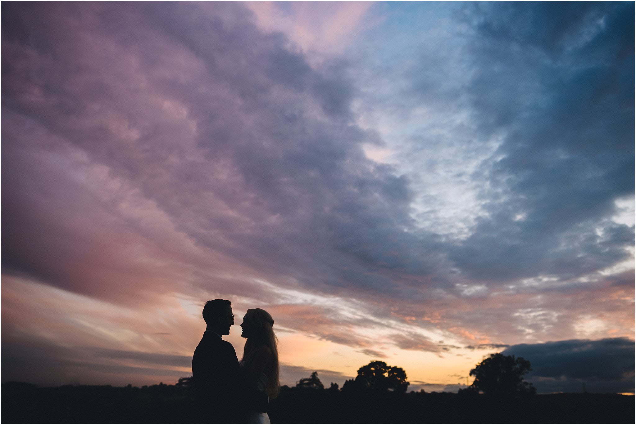 married couple and sunset