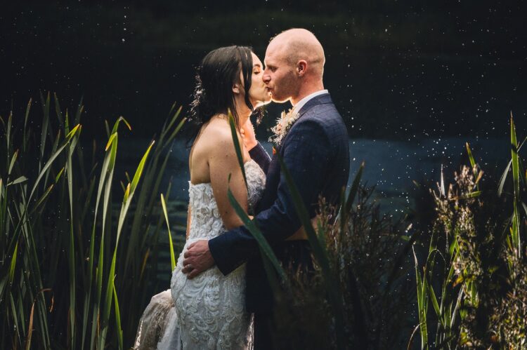 Lyde Arundel weddings - just married couple during their photo session in the rain