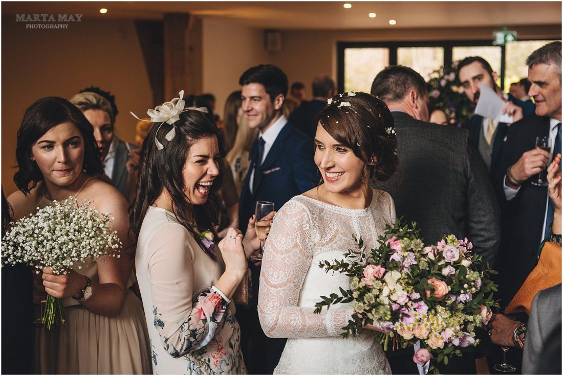 Mill Barns wedding photography bride chatting with guests