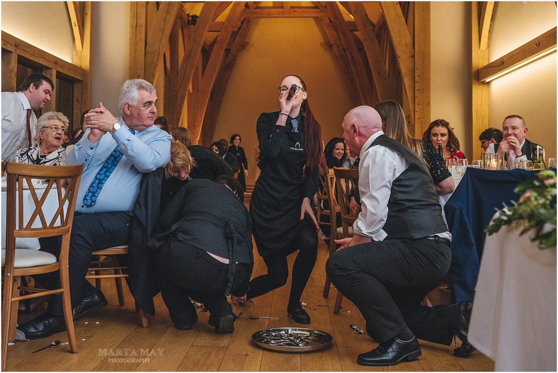 the Undercover artists singing waiters at the Mill Barns