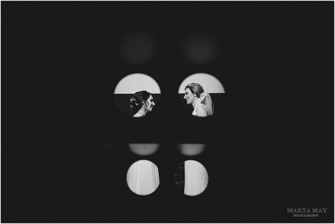 Mill Barns wedding photography creative image of two brides looking at each other