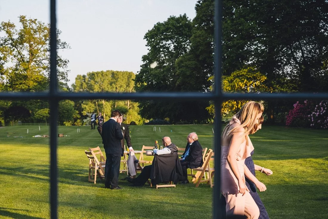 wedding guests enjoing the front lawn at Homme House