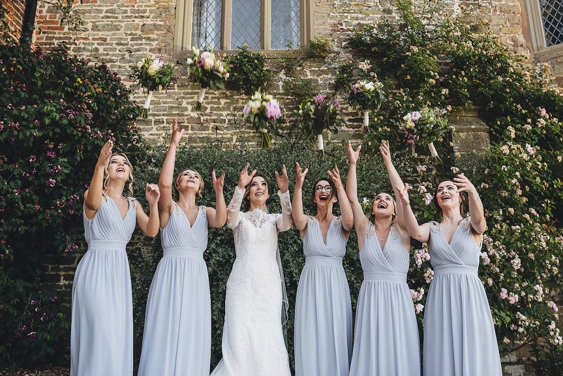 bride and bridesmaids throwing bouquets at Homme House