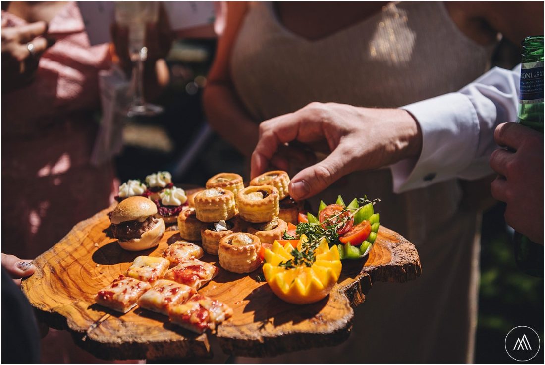 a hand lifting a canape during the reception drinks at Birtsmorton Court