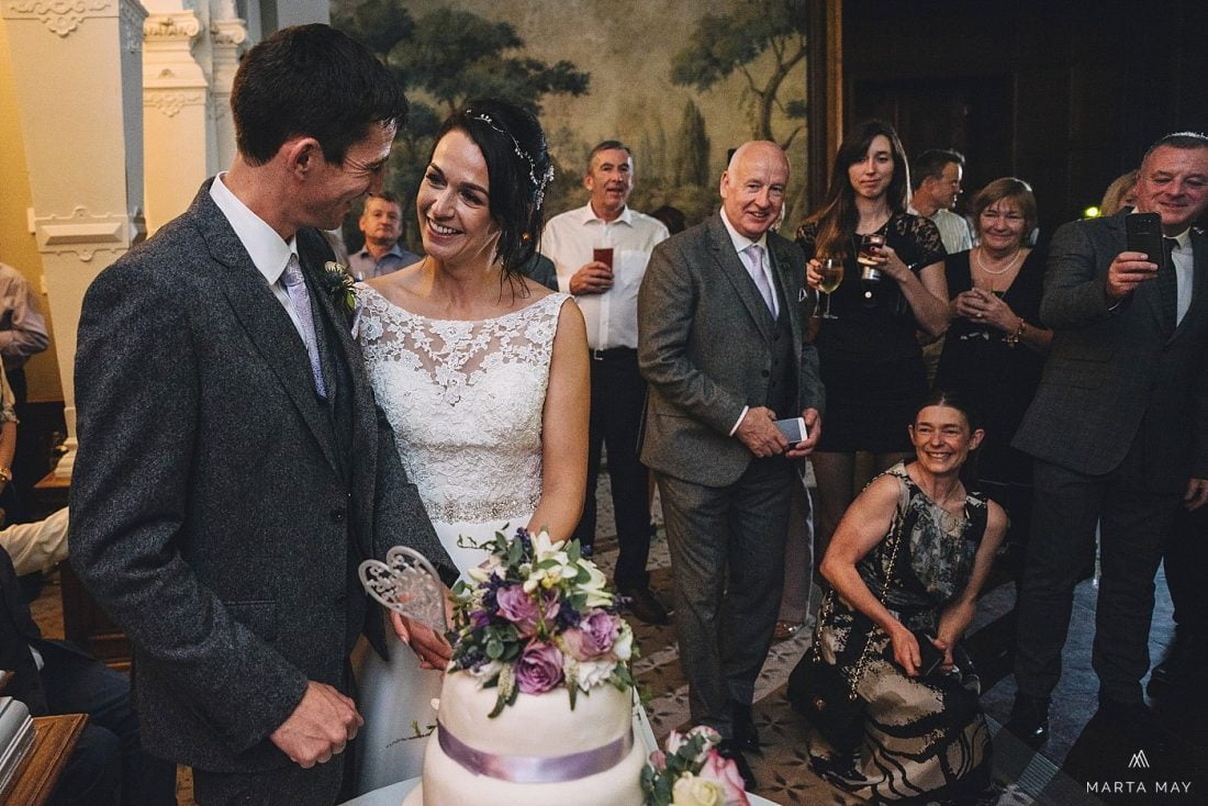 cake cutting by the bride and groom at clevedon hall, somerset wedding photography