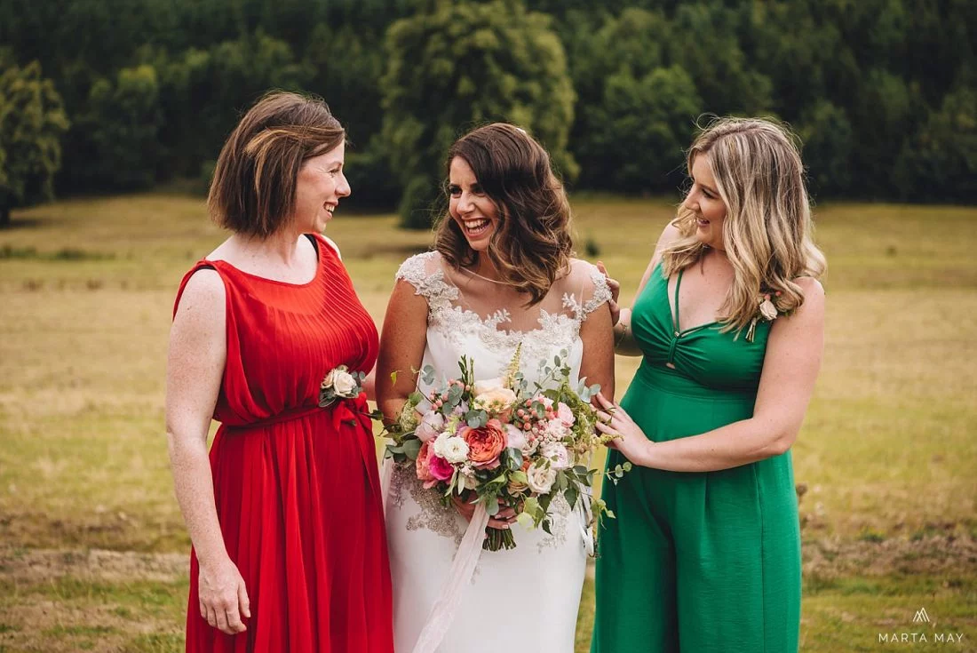 bride laughing with her best friends at Walcot Hall