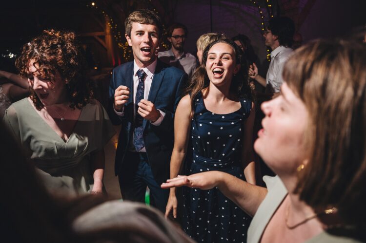 wedding guests dancing at Redhouse barn