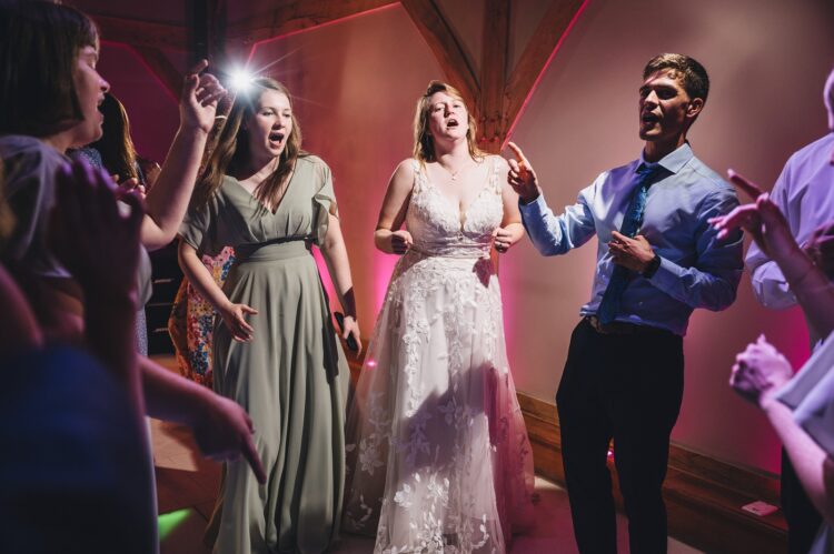 wedding guests dancing at Redhouse barn