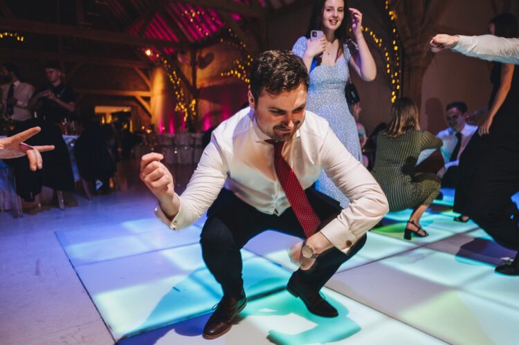 wedding guests dancing at Redhouse barn