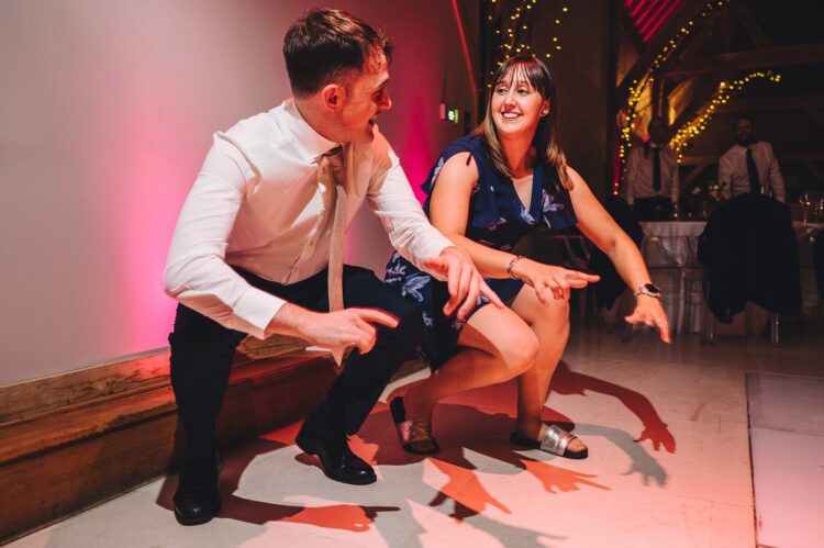 wedding guests dancing at Redhouse barn