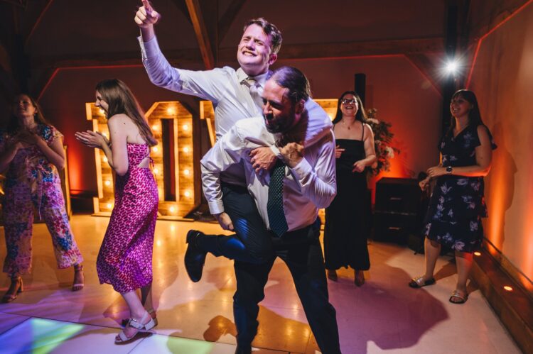 wedding guests dancing at Redhouse barn