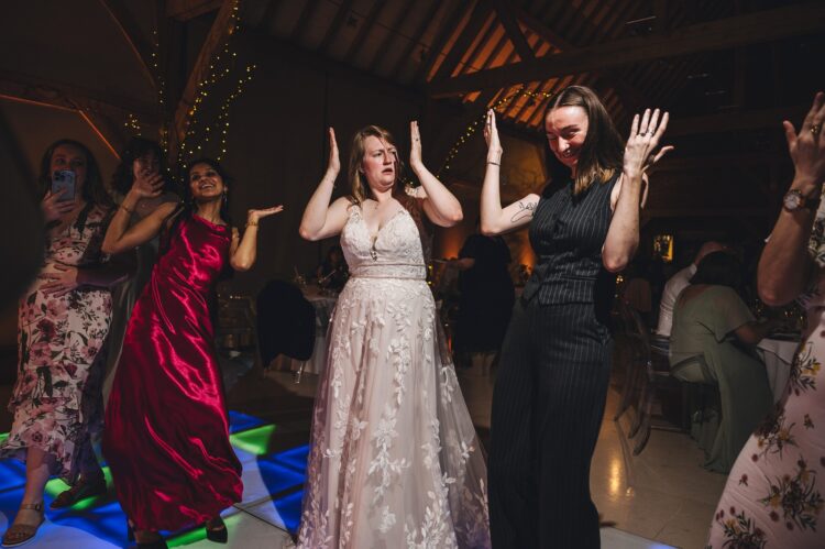 wedding guests dancing at Redhouse barn