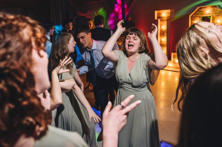 wedding guests dancing at Redhouse barn