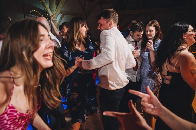 wedding guests dancing at Redhouse barn