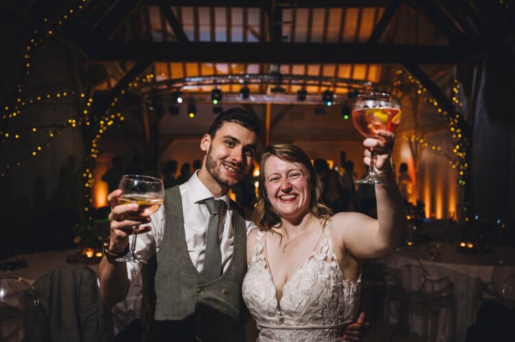 bride and groom enjoying the evening at Redhouse Barn