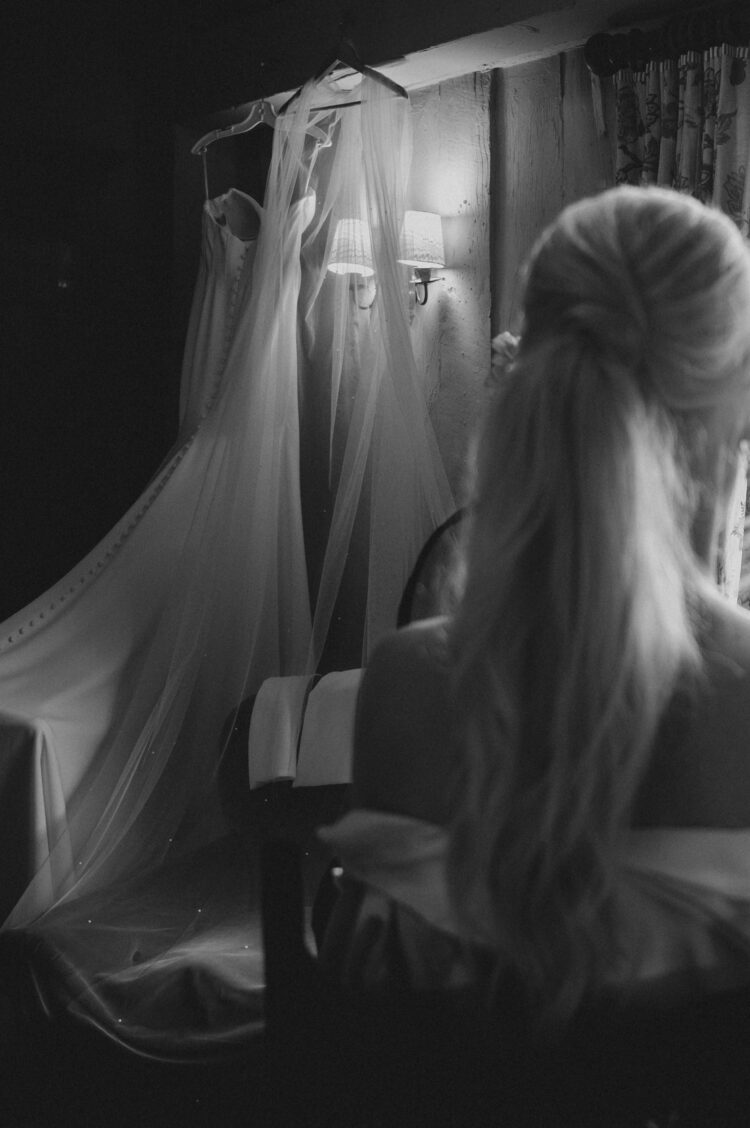 bride getting ready with bridesmaids at Pauntley Court Gloucestershire