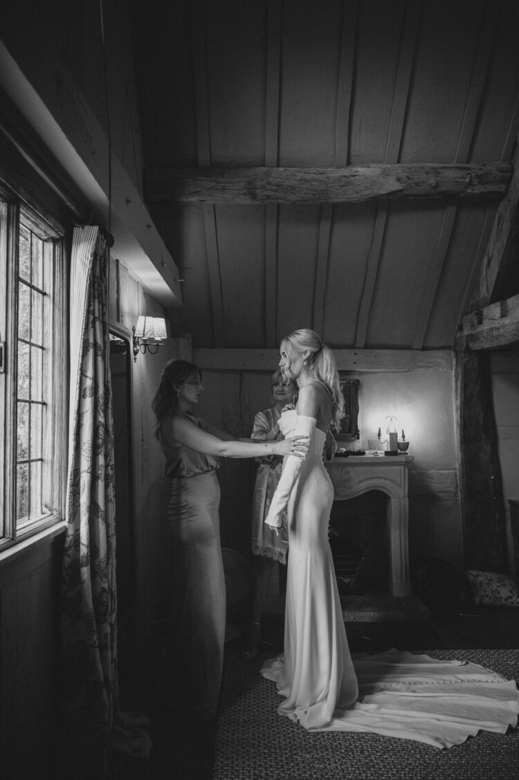 bride getting ready with bridesmaids at Pauntley Court Gloucestershire