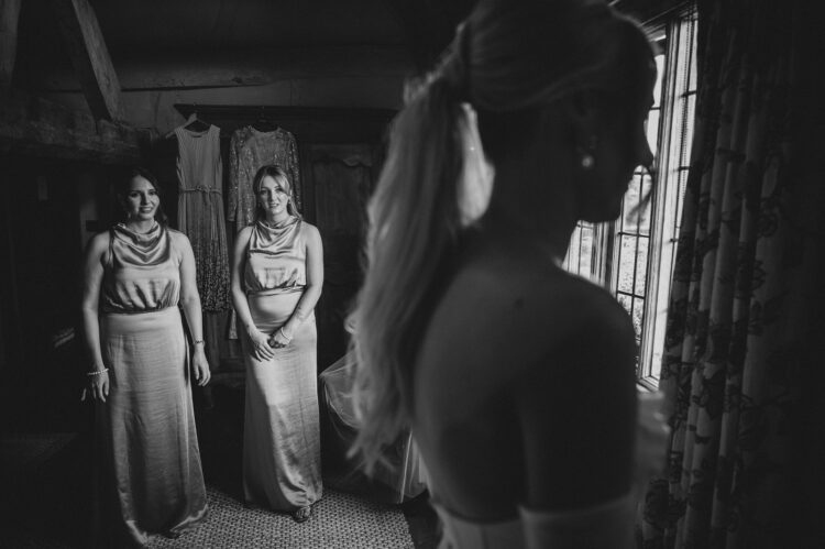 bride getting ready with bridesmaids at Pauntley Court Gloucestershire
