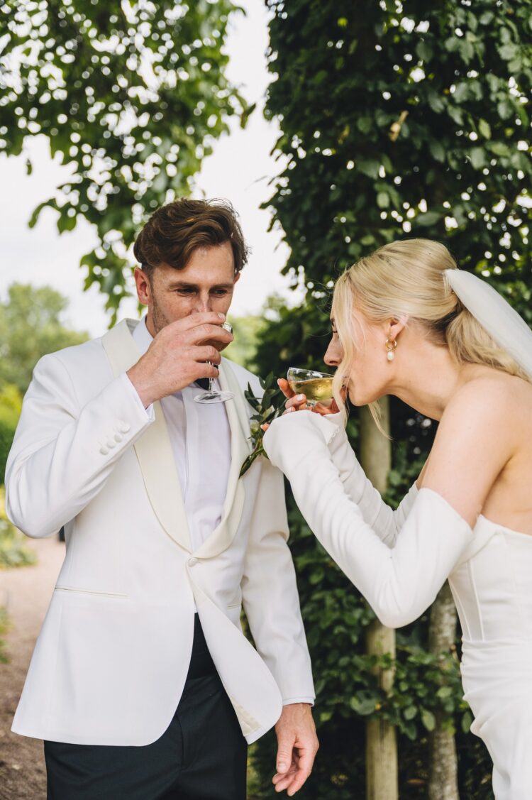 bride and groom having reception drinks at Pauntley COurt