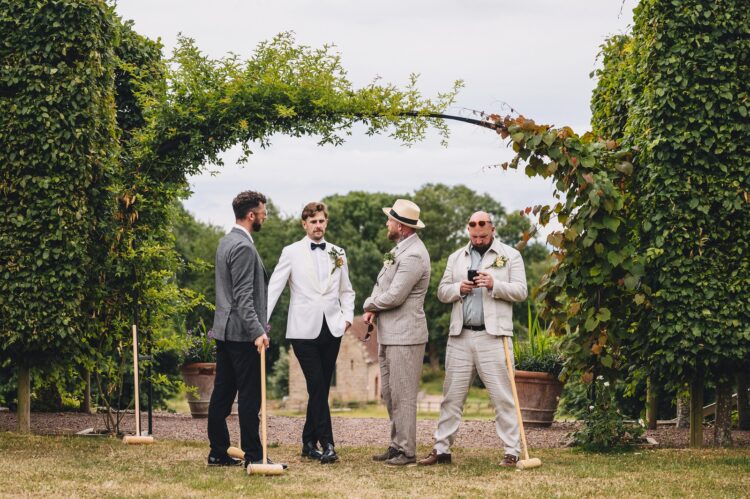 wedding guests having a great time during reception drinks at Pauntley court gloucestershire