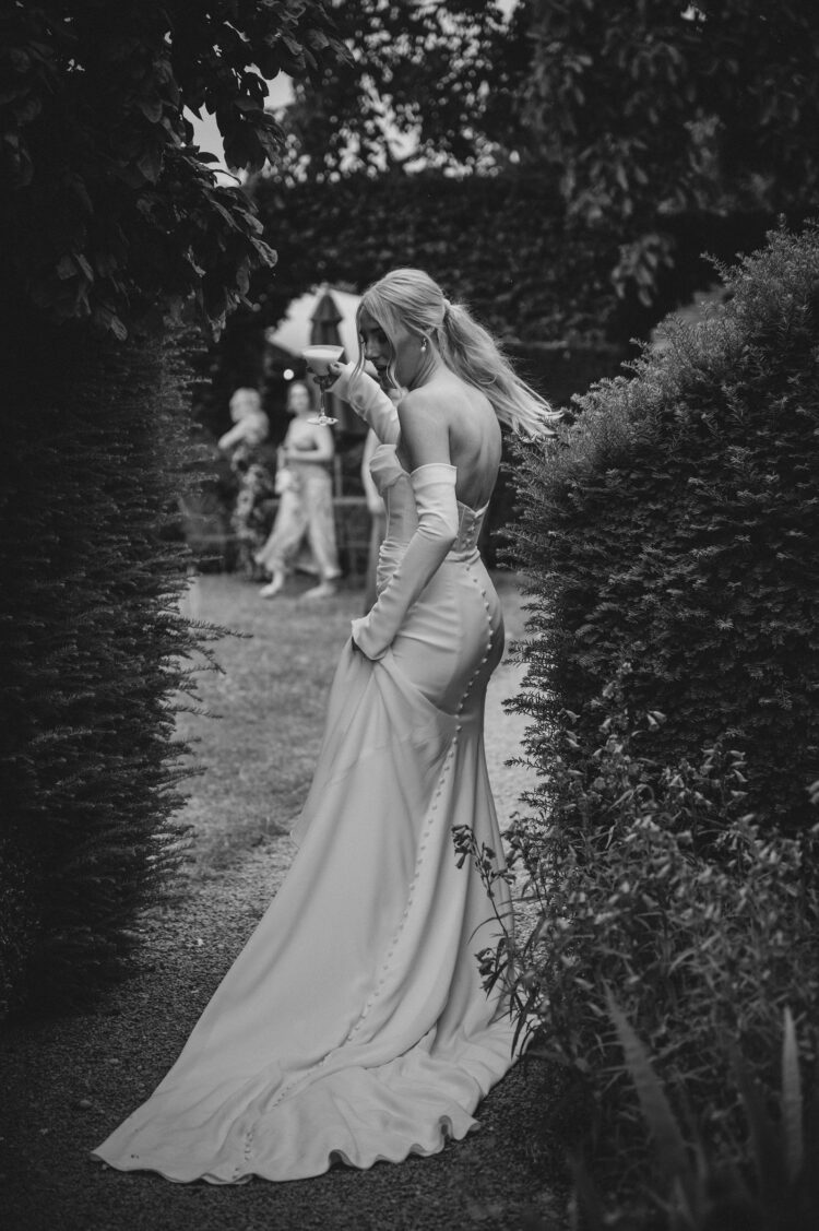 bride having a great time during reception drinks at Pauntley court gloucestershire