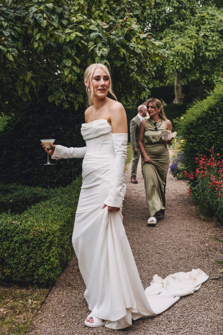 bride having a great time during reception drinks at Pauntley court gloucestershire