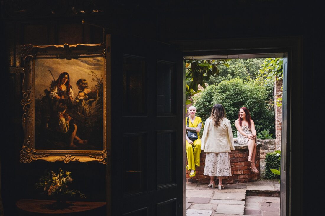 wedding guests having a great time during reception drinks at Pauntley court gloucestershire wedding photographer