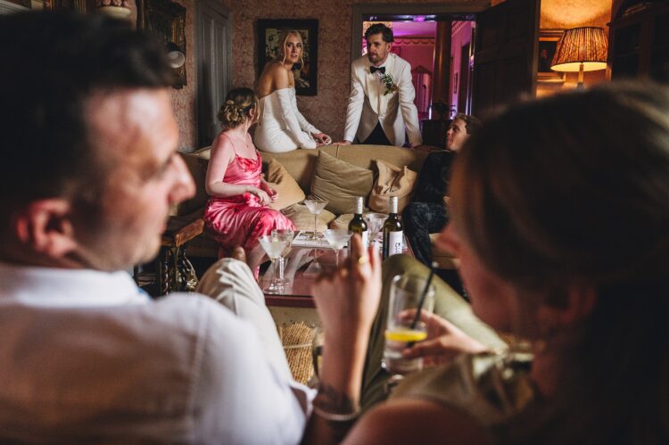 wedding guests having a great time during reception drinks at Pauntley court gloucestershire