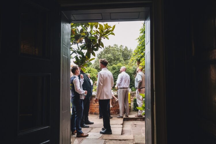 wedding guests having a great time during reception drinks at Pauntley court gloucestershire