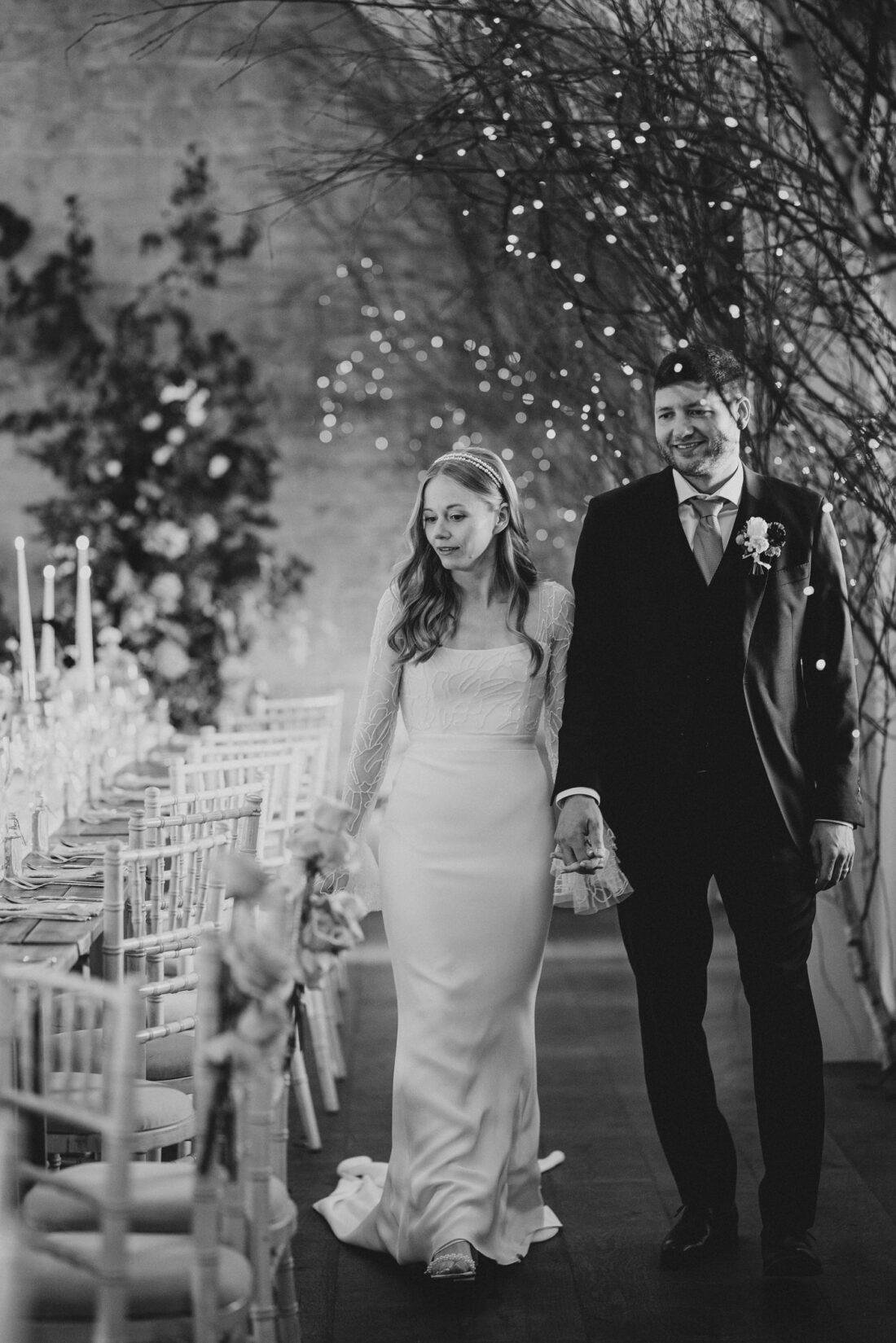 bride and groom seeing the reception room just before the wedding guests come in at Lapstone Barn Cotswolds