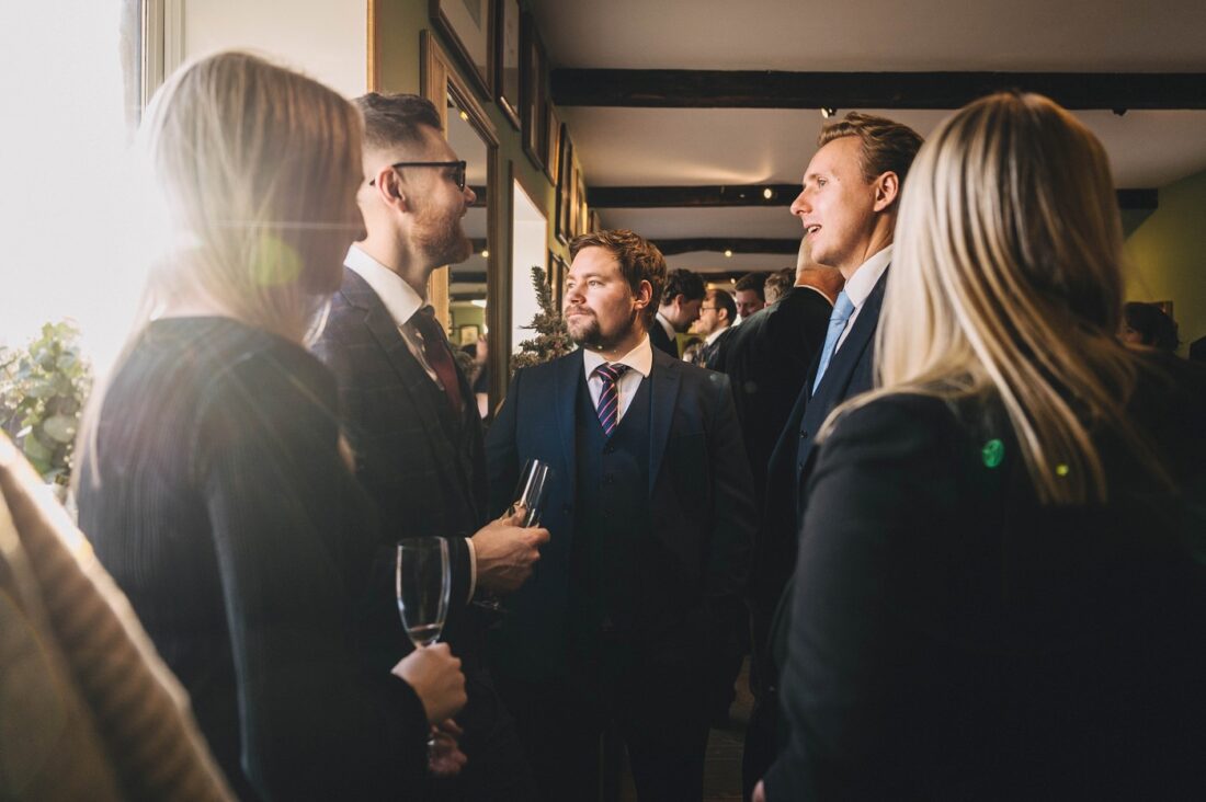 wedding guests having drinks and canapes after the ceremony at Merriscourt