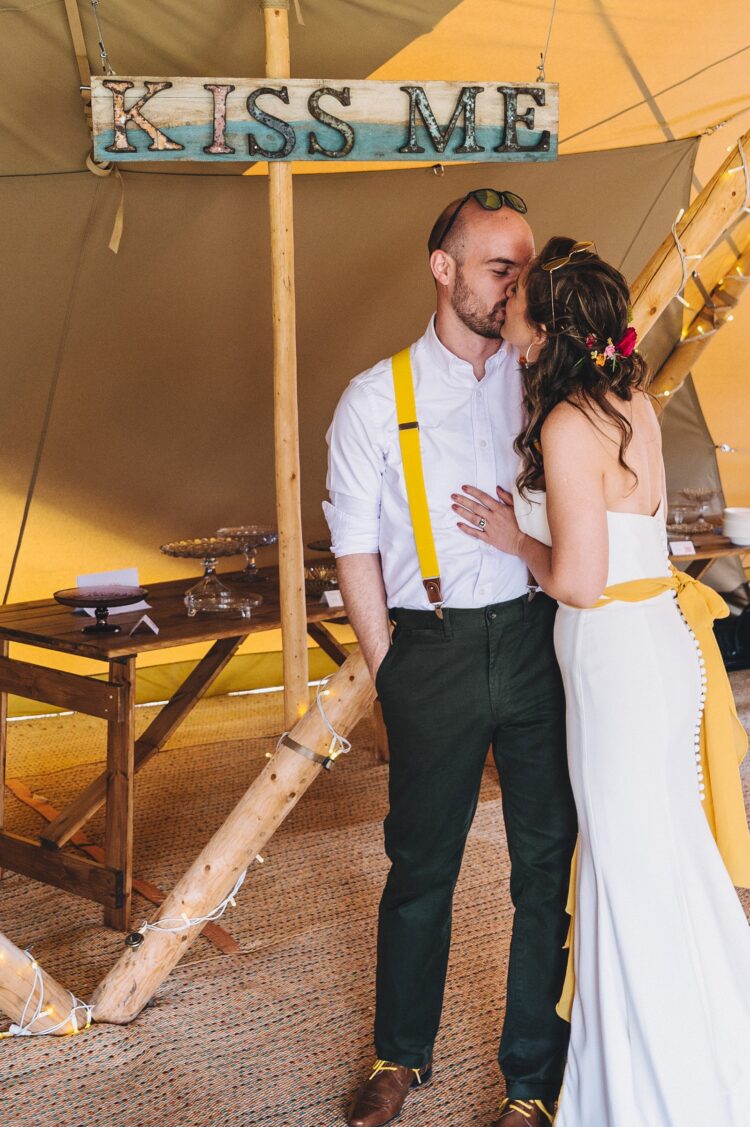 bride and groom entering tipi at the orchard at munsley