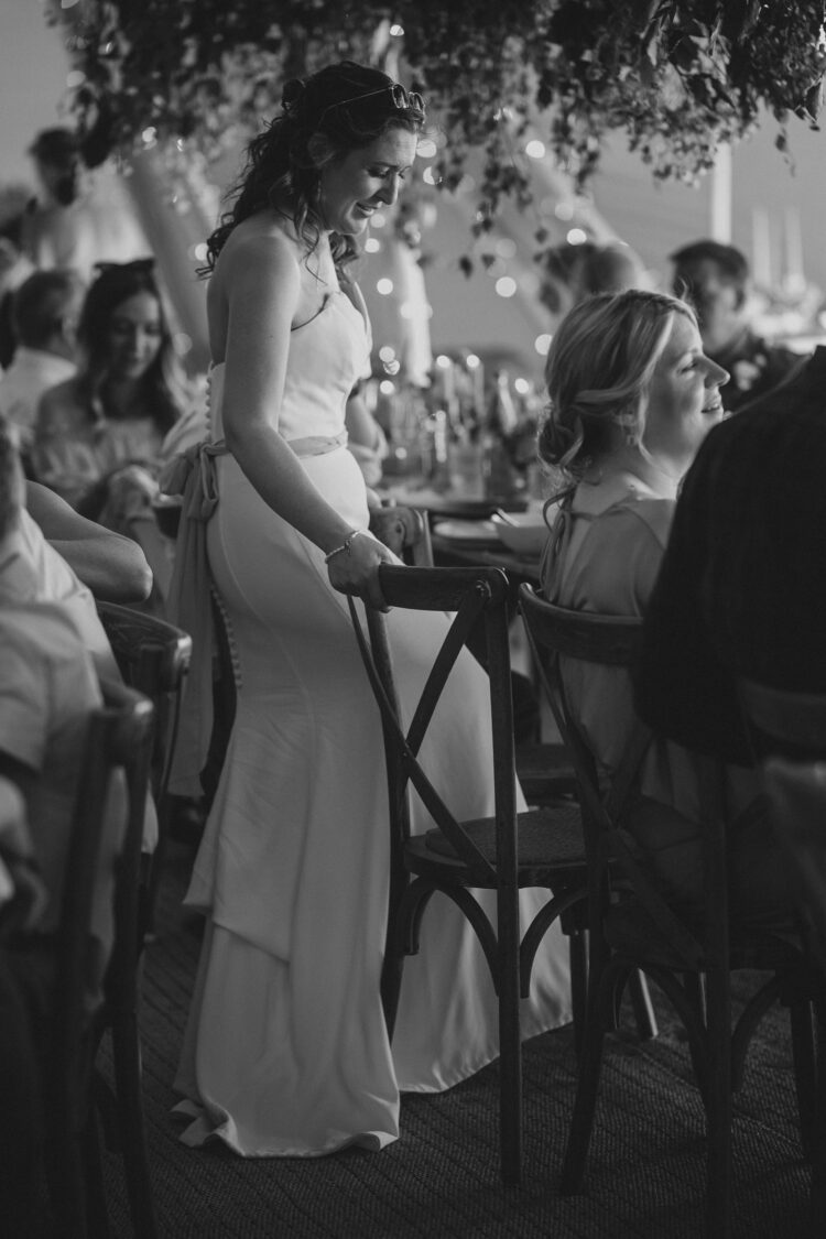 bride during wedding speeches at tipi Orchard at Munsley
