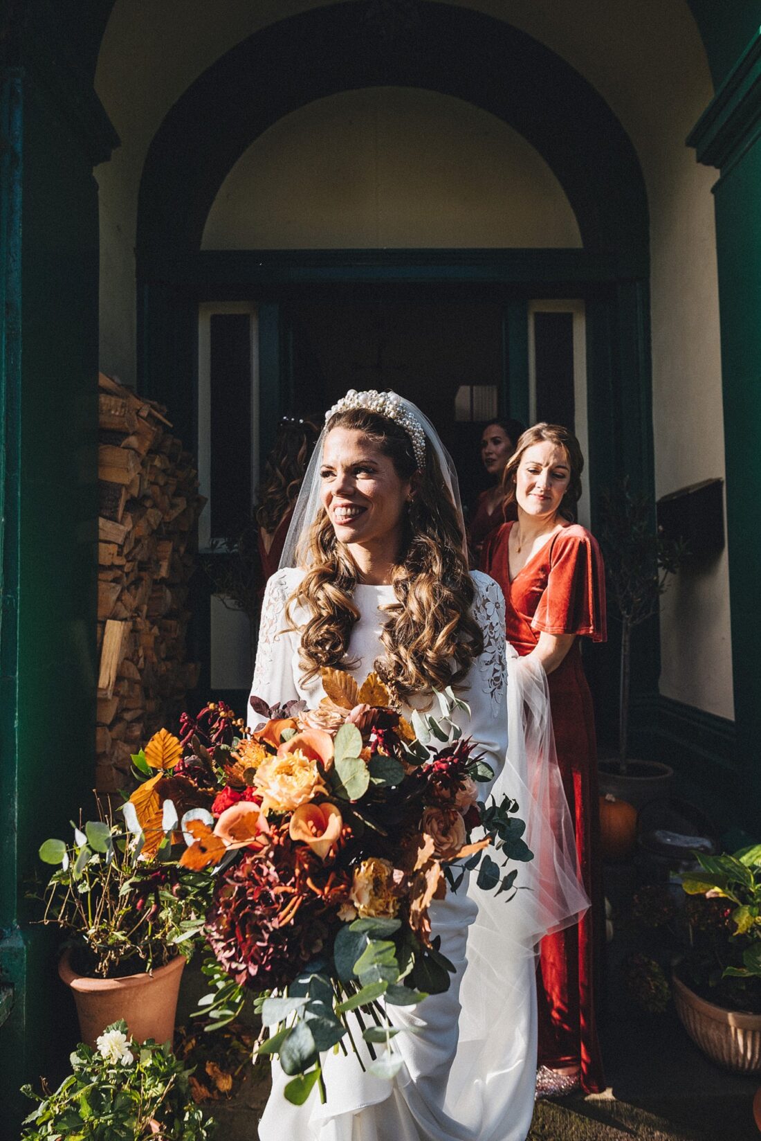 bride leaving her house with bridesmaids, on the way to the church ceremony