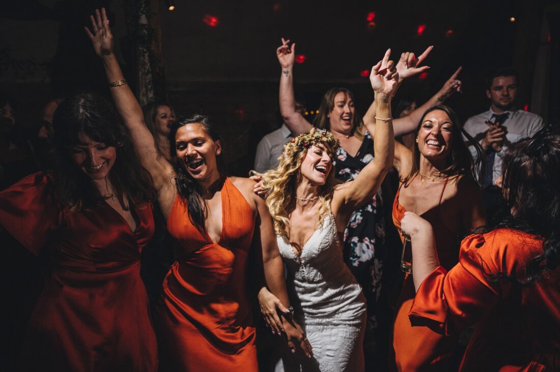 bride and bridesmaids dancing the night away, dance floor fun