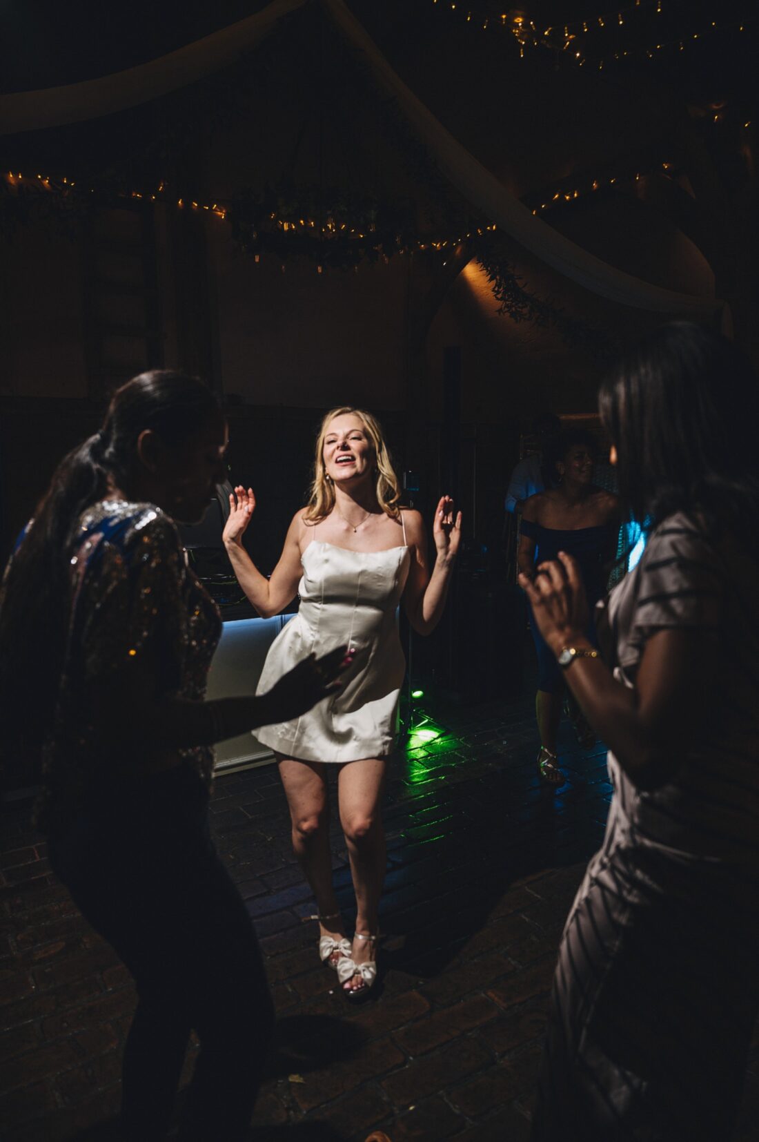 bride on the dance floor in a short dress at Lains Barn