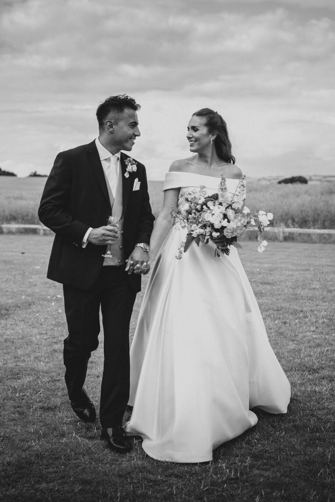 bride and groom walking at Lapstone Barn