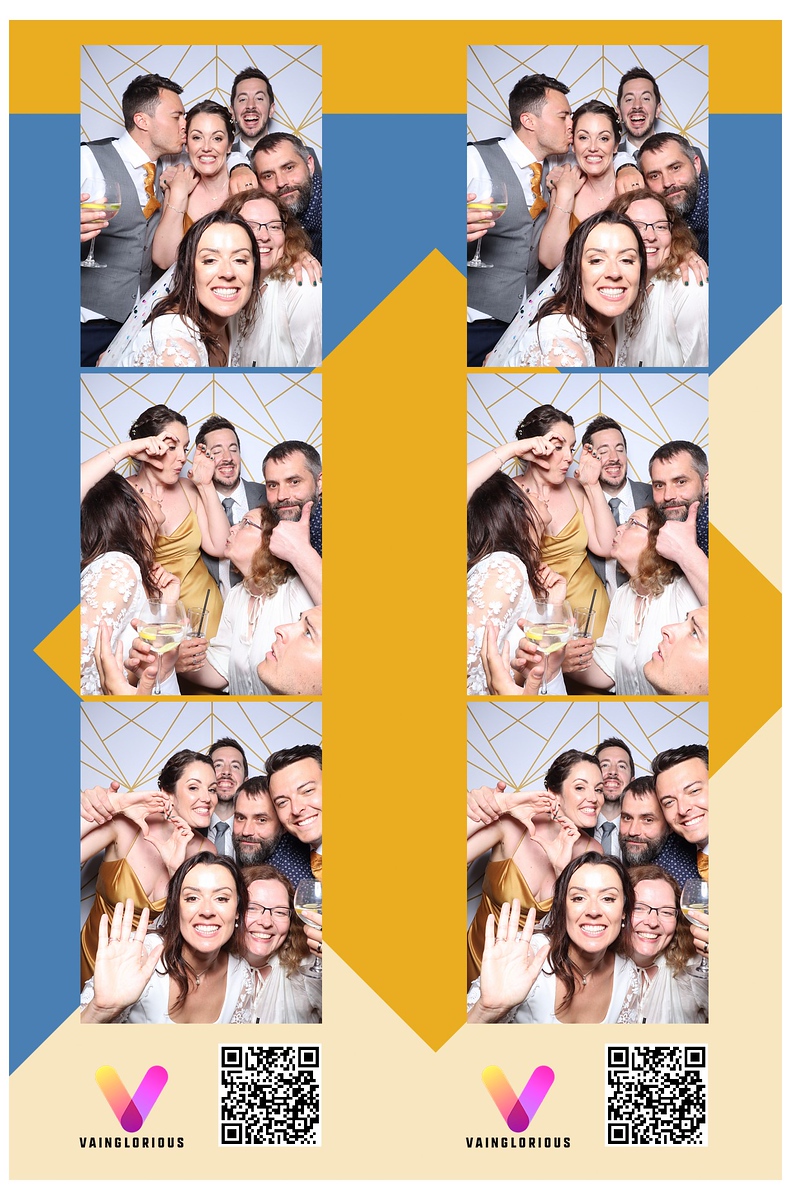 The Mays posing in a photo booth with bride and grom and wedding guests at Brinsop Court