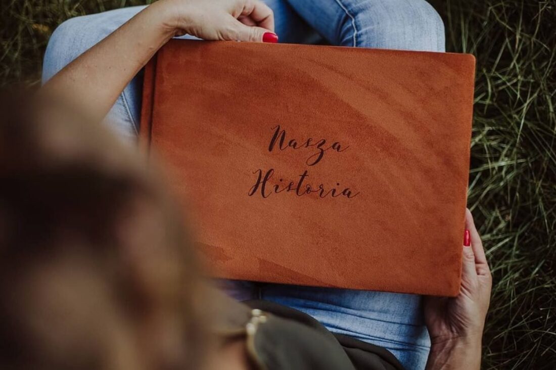 woman holding a wedding album