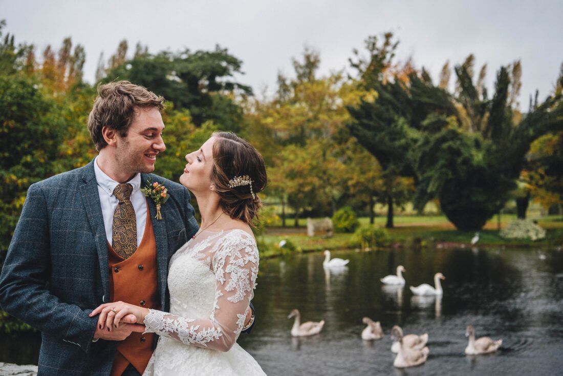 Bride Groom and swans on the moat at Brinsop Court