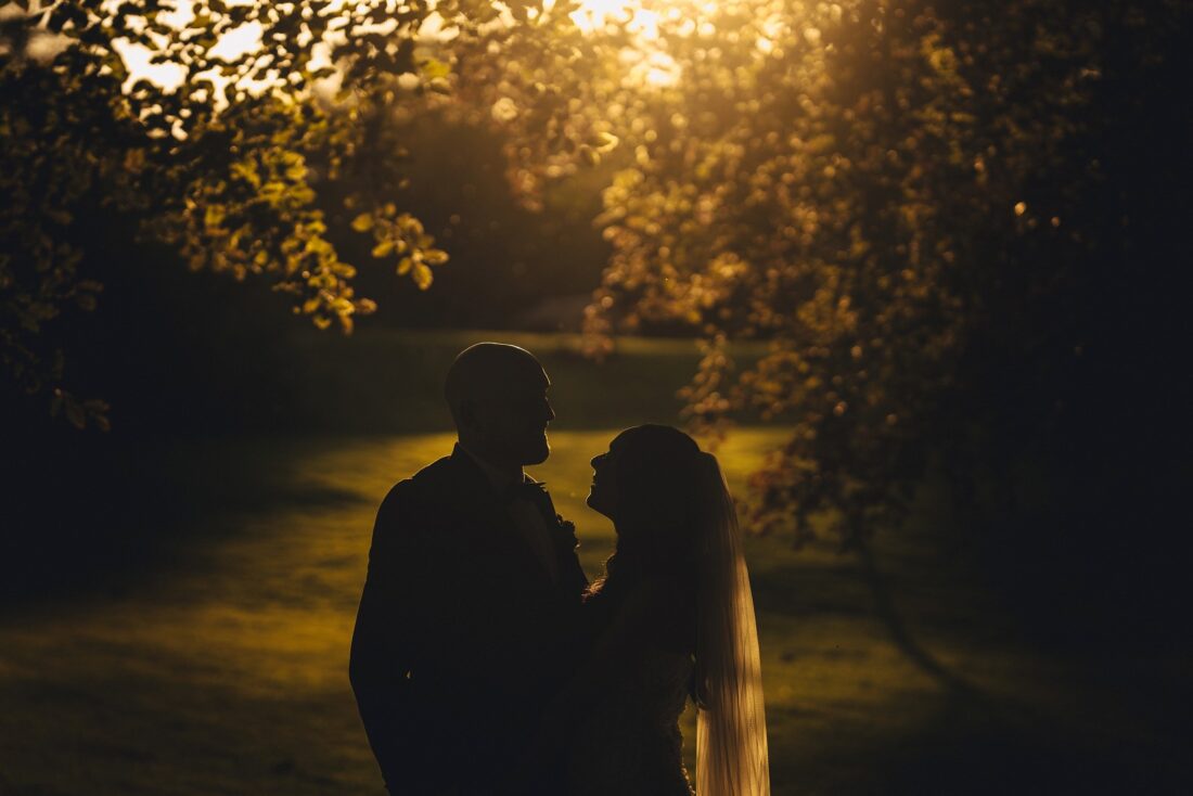 bride and groom photos in the golden hour at Bredenbury Court barns